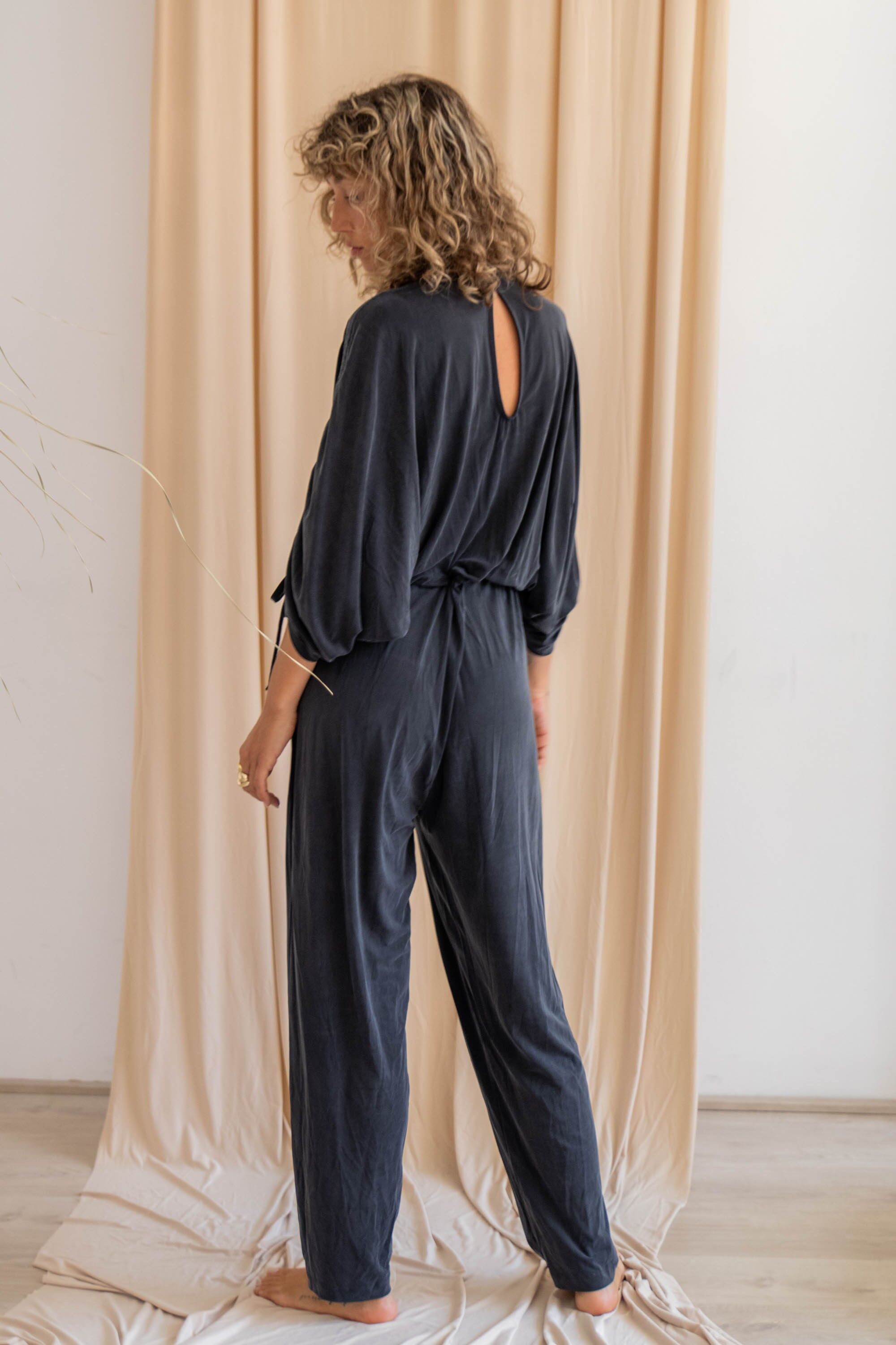 Black batwing jumpsuit deals